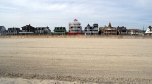 Beach Street, Cape May NJ. Landscape view of the hotels, motels, mansions of a by gone era. Americana. Retro/vintage vibe. Old Fashioned American Vacation. Very popular in the 1940s and 1950s. It is still a very popular tourist destination today.