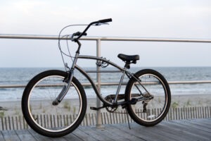 A bicycle chained to the Ocean City New Jersey Boardwalk overlooking the Atlantic ocean