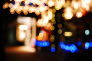 Bright Christmas lights, intentionally blurred, brighten a december night