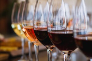 Selective focus on a selection of red, rose and white wines during a wine tasting event on the island of Crete in Greece